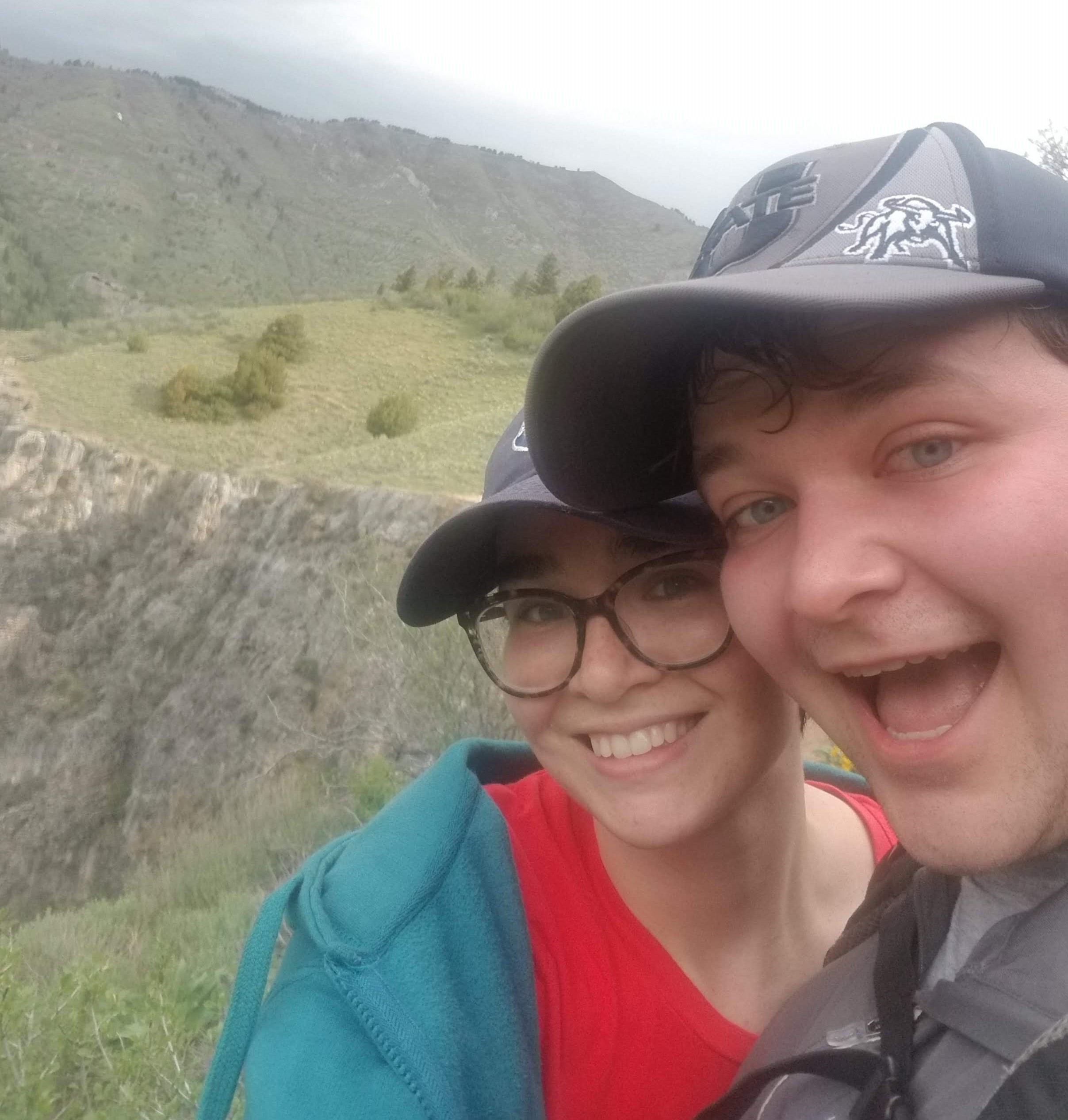 A picture of myself and my spouse from the ridge of a mountain overlooking Cache Valley.
